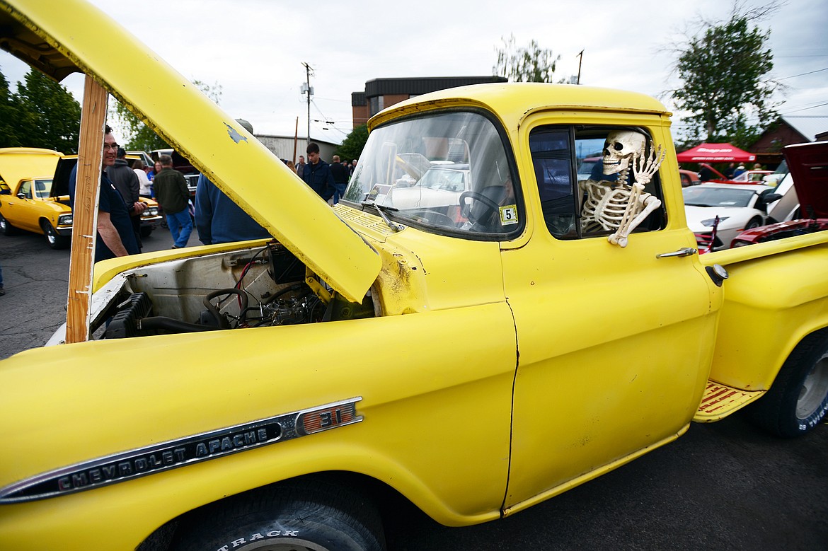 A skeleton waves from a 1959 Chevy Apache 3100 owned by Tom Narden at The Big Shindig outside The DeSoto Grill in Kalispell on Saturday. The Big Shindig features a wide range of cars as well as live music, barbeque, beer and a pin-up polar plunge. (Casey Kreider/Daily Inter Lake)