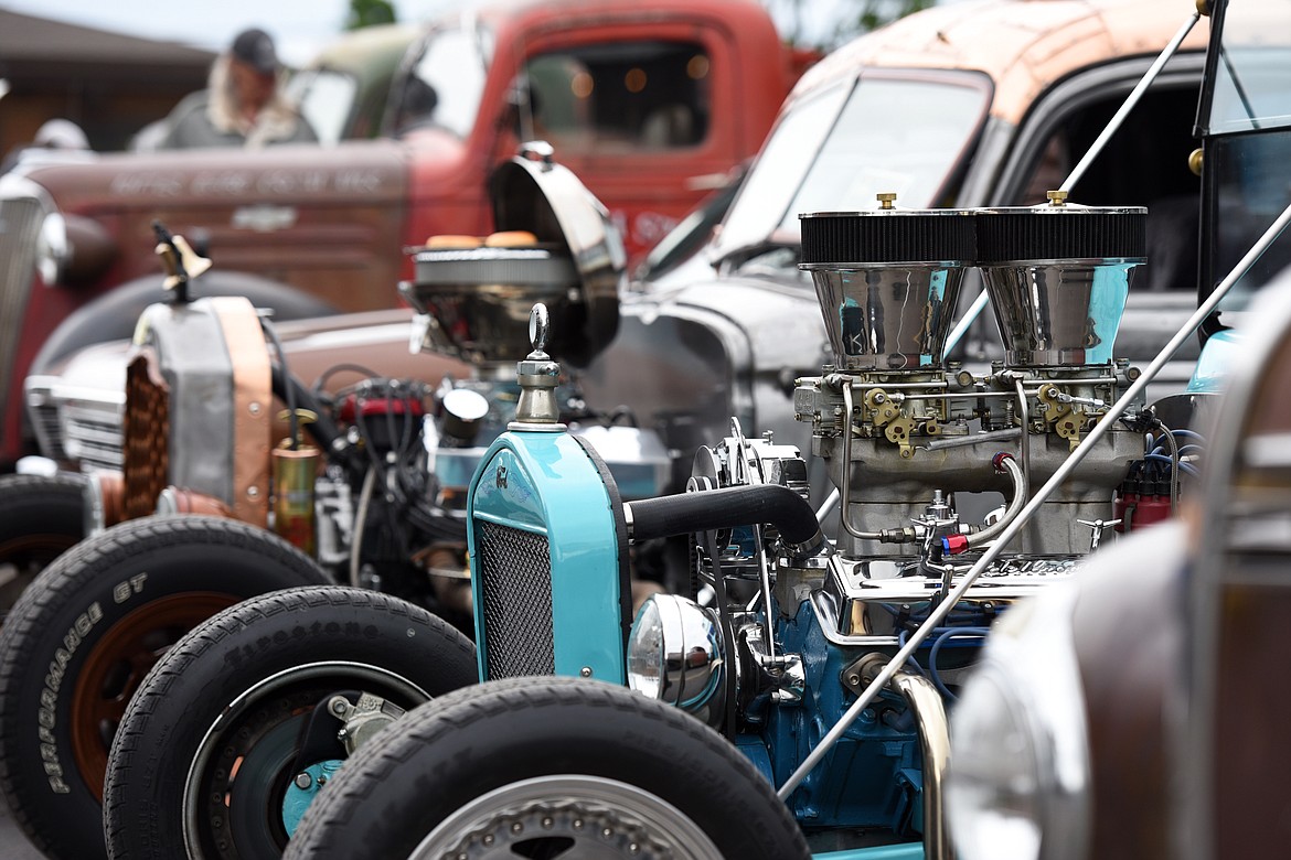 A 1926 Ford T-Bucket, right, owned by Ricco Montini, sits next to a 1949 Chevy Rat Rod with a 351C Ford engine, owned by Greg and Tana Greene, at The Big Shindig outside The DeSoto Grill in Kalispell on Saturday. The Big Shindig features a wide range of classic, custom and unfinished cars as well as live music, barbeque, beer and a pin-up polar plunge. (Casey Kreider/Daily Inter Lake)