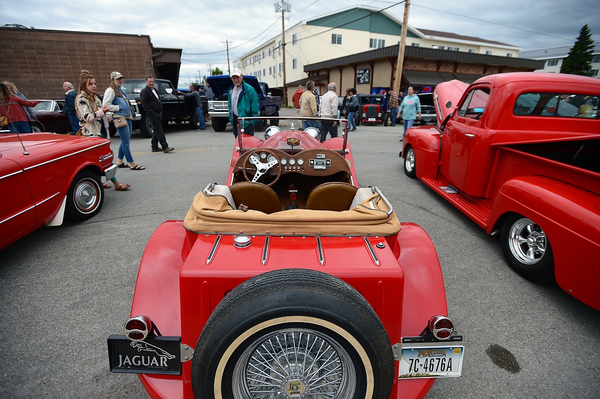 Visitors walk around a 1937 Jaguar with a 1976 Pinto engine and chassis owned by Janet Monk at The Big Shindig outside The DeSoto Grill in Kalispell on Saturday. The Big Shindig features a wide range of classic, custom and unfinished cars as well as live music, barbeque, beer and a pin-up polar plunge. (Casey Kreider/Daily Inter Lake)