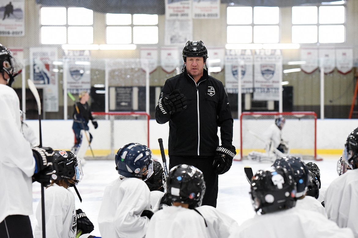 Derek Armstrong, a former Los Angeles King and current director of hockey programming and curriculum with the team, speaks to the group of campers at the L.A. Kings Summer Camp-Whitefish at Stumptown Ice Den in Whitefish on Thursday. (Casey Kreider/Daily Inter Lake)