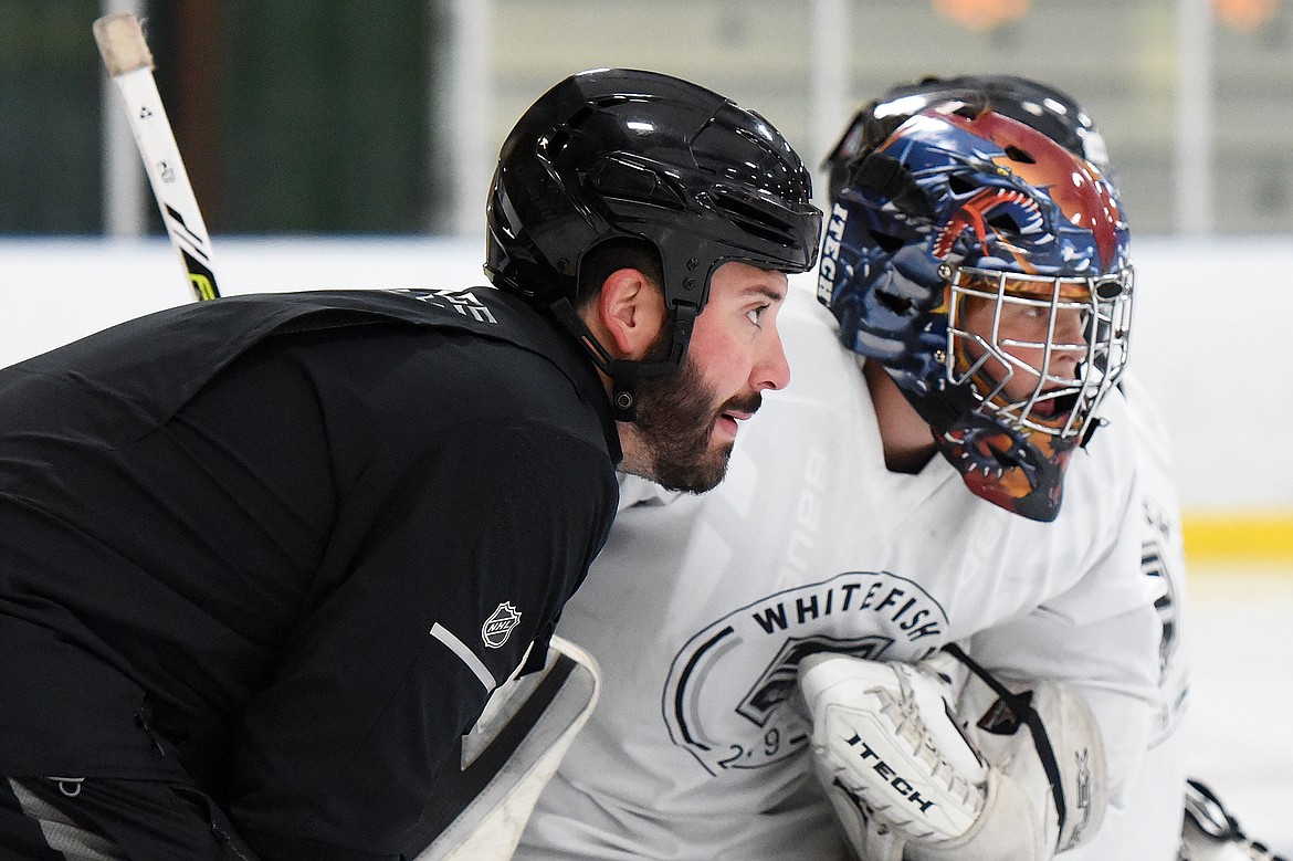 Courtney Ports, manager of hockey development with the Los Angeles Kings, speaks with a camper during a drill at the L.A. Kings Summer Camp-Whitefish at Stumptown Ice Den in Whitefish on Thursday. (Casey Kreider/Daily Inter Lake)