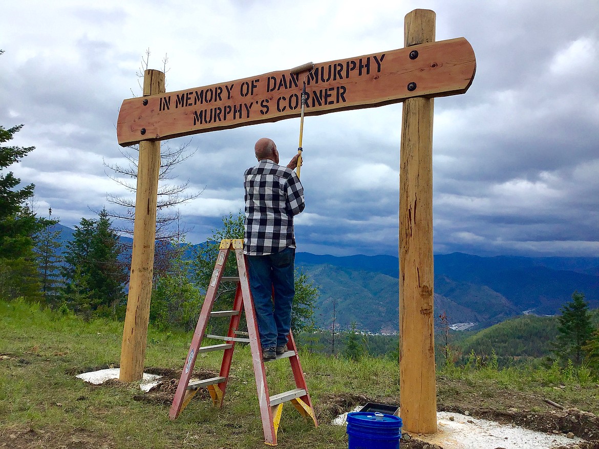 Photo courtesy of ARNOLD BIRCHER
Arnold Bircher adds the finishing touches to the sign after it was placed in the ground.