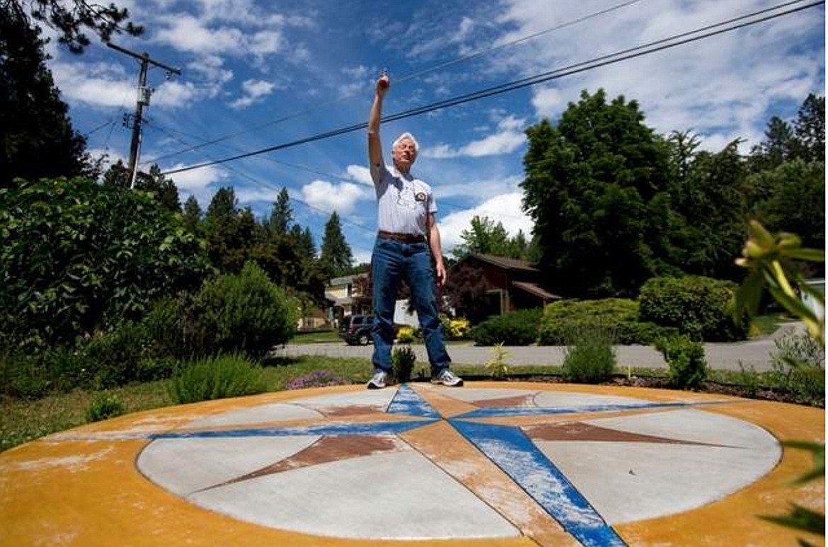 JAKE PARRISH/Press file
Ray Tekverk, a retired science teacher, points to planets in the sky, something he can accurately do using the compass rose he built in his front yard. The compass rose&#146;s north point, where Tekverk is standing in this photograph, points to a perfect true north.