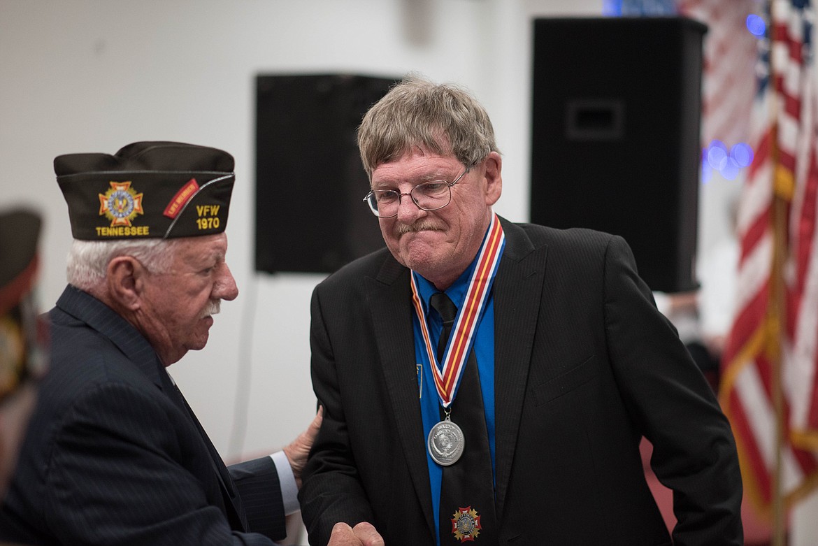 Jack Hawley, right, receives the Veterans of Foreign Wars member of the year award during a VFW convention Friday in Libby. (Luke Hollister/The Western News)