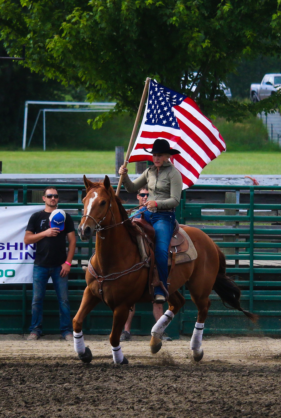 Whitney LaValley carrying the American flag.