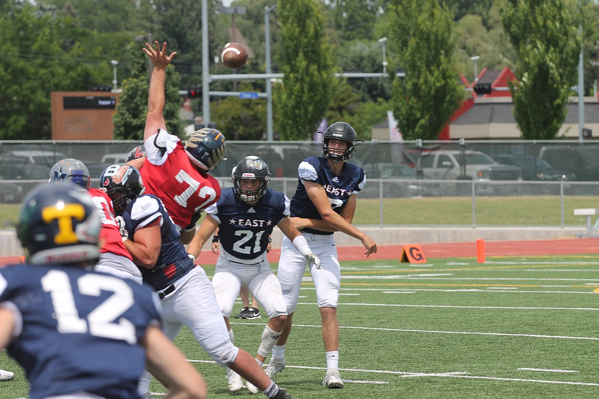 Casey McCarthy/Columbia Basin Herald 
Royal's Sawyer Jenks throws the pass in the first half for the East side in the Earl Barden Classic in Yakima on Saturday.