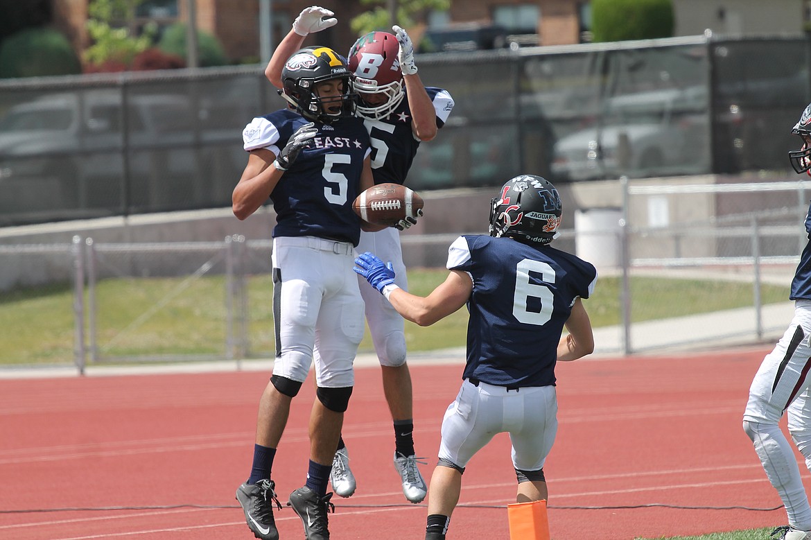 Casey McCarthy/Sun Tribune
Royal&#146;s Angel Farias celebrates with East teammates after scoring at the 25th annual Earl Barden Classic on Saturday.