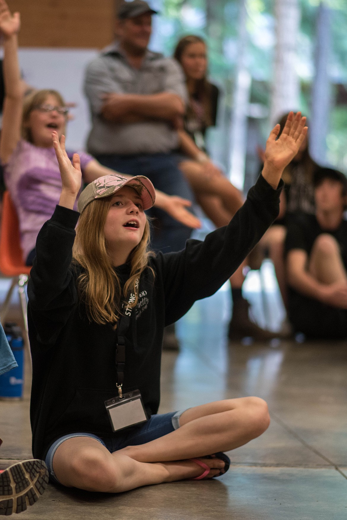A teenager cheers as she watches classmates show how communities could help homeless people. (Luke Hollister/The Western News)