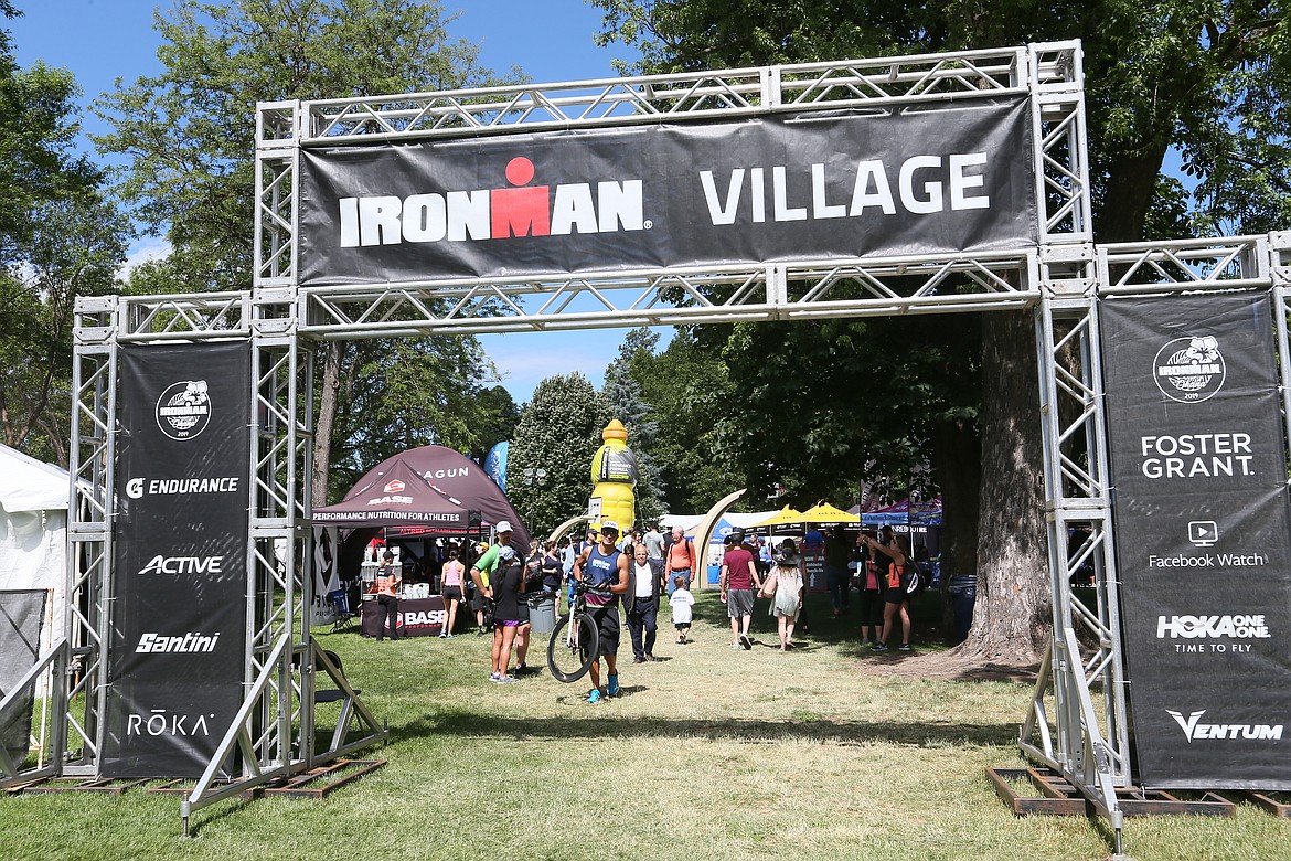 A variety of information and merchant booths are available at the Ironman Village. (JULIA BENNETT/Press)