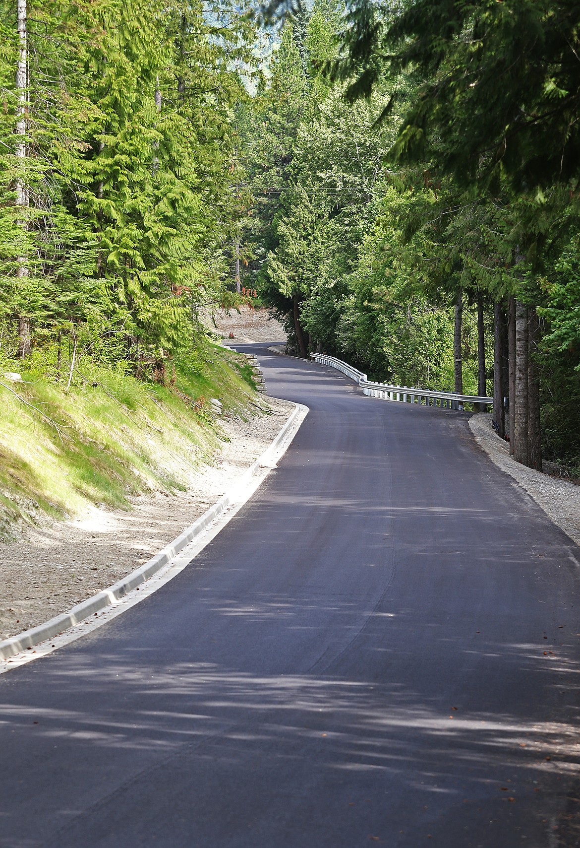 LOREN BENOIT/Press 
Barrett Road, which leads to a long-anticipated recreation site on Rathdrum Mountain, has been widened and paved as required by the Post Falls Highway District. The city of Rathdrum site is scheduled to open on Aug. 10.