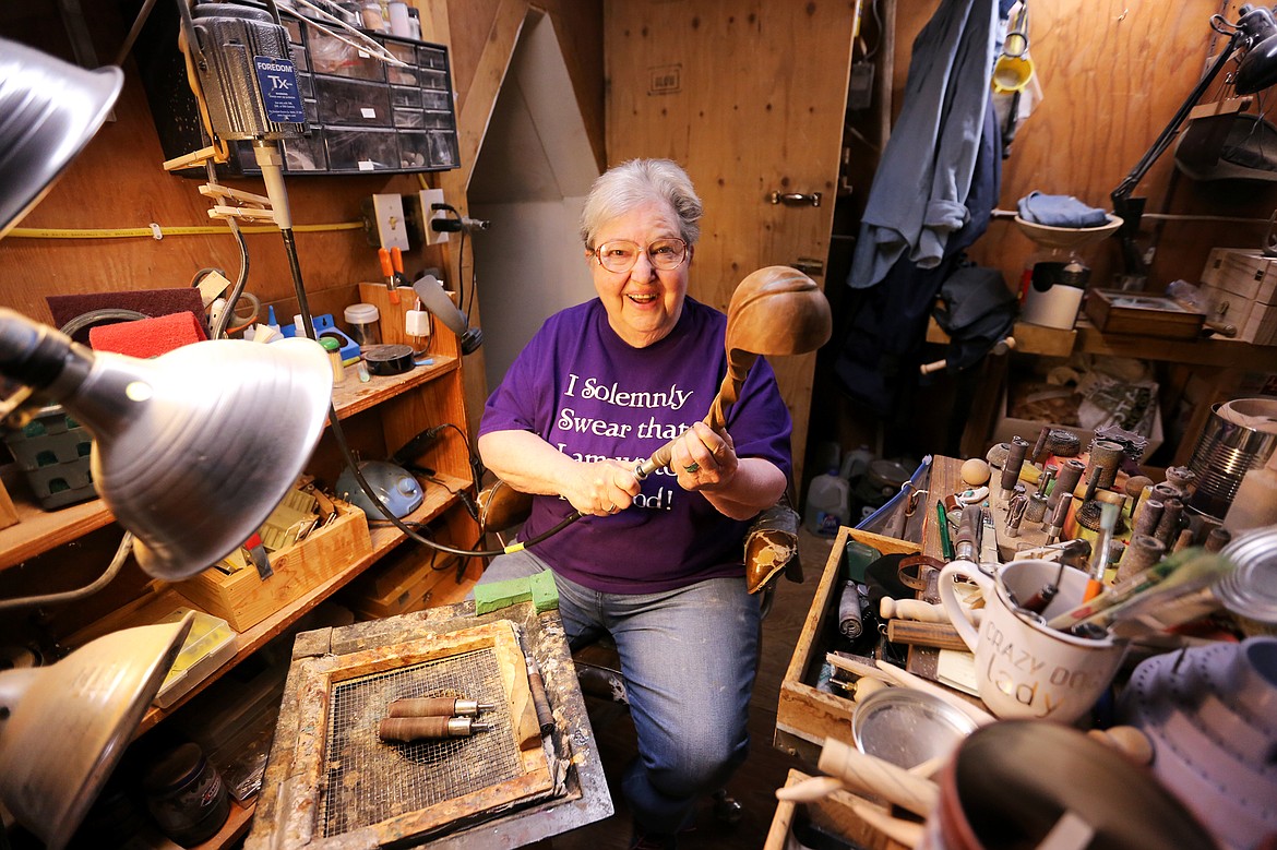 Jo Hodges-Wagner sands a spoon at her work station inside the Spiral Spoon, which she&#146;s operated for the past two decades.