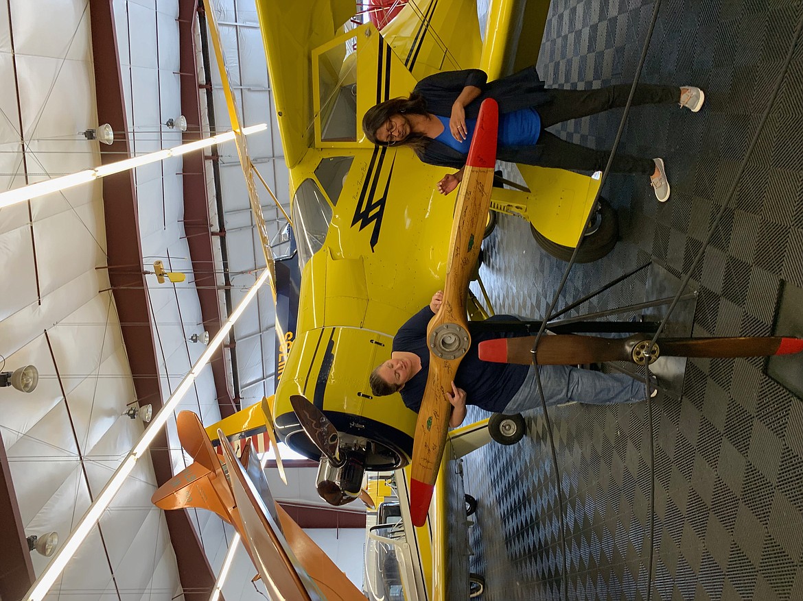 Bird Museum Director Rachel Schwam shows visitor Rini Paiva signatures of nationally famous inventors on a wooden propellor, including that of another local inventor-aviator, Burt Rutan (SHOLEH PATRICK/Press).