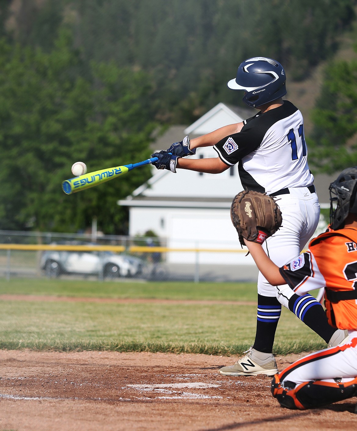 Coeur d&#146;Alene Kyle Johnson makes contact and hits a home run in a game against Post Falls last Friday.