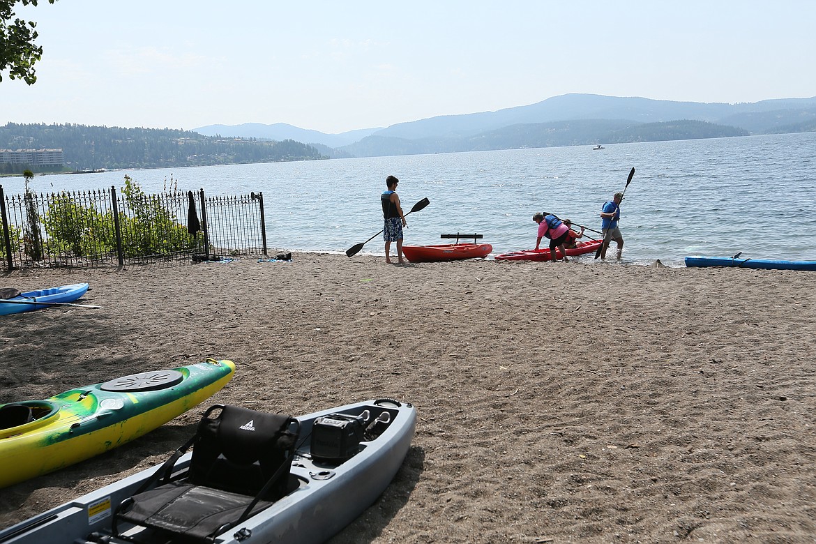 JULIA BENNETT/ Press Kayaks brought the paddles to Sanders Beach Saturday during Paddle for the Peaceful.