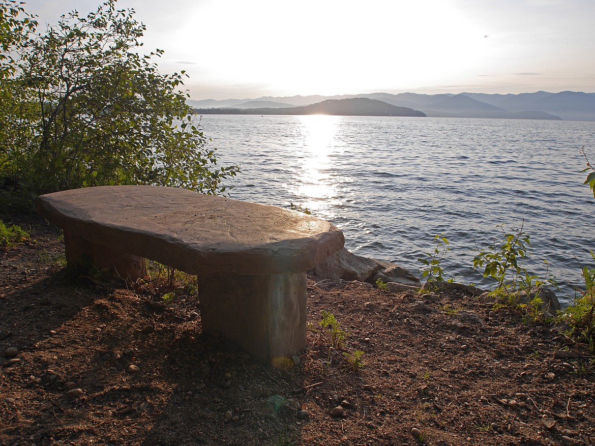 (Photo by DWAYNE PARSONS)
A stone bench along the Pend d&#146;Oreille Bay Trail provides the ideal spot to enjoy the beauty of Lake Pend Oreille..