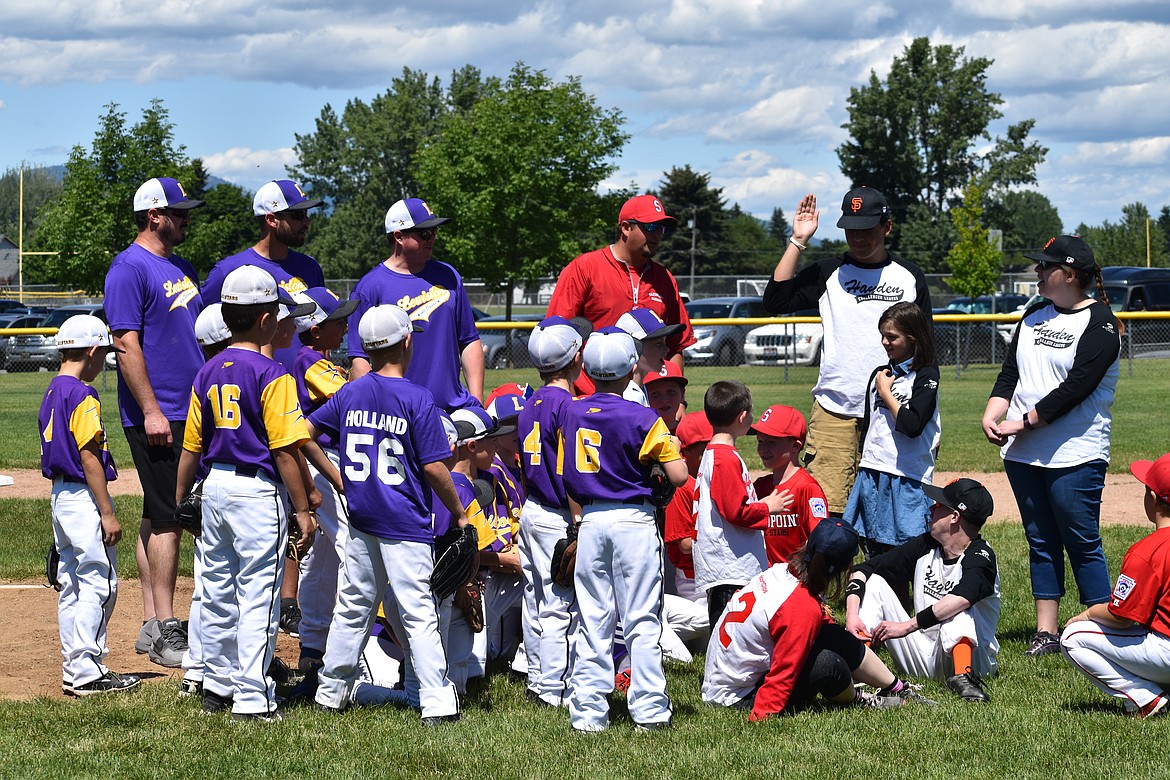 (Photo courtesy of RICKY KLONTZ)
Lewiston and Sandpoint teams gather for the Challenger game on June 30. Challenger is a division of Little League for kids with physical or mental limitations that prevent them from enjoying a sport that millions of other kids around the world get to play every year. Players from other divisions help host by being &#147;baseball buddies,&#148; in which they help Challenger players hit, field and run the bases.