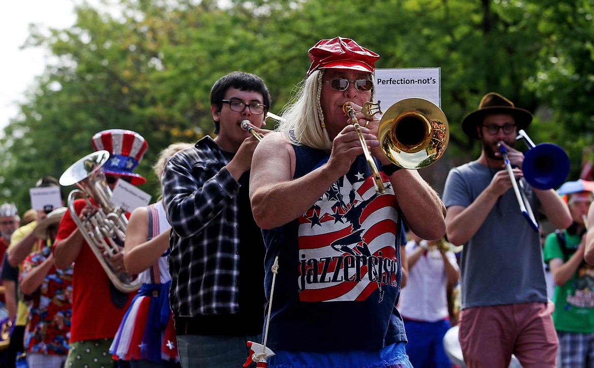 Denny Burt plays a tune with other Perfection-not's band members during the Fourth of July Parade on Sherman Avenue. (LOREN BENOIT/Press)