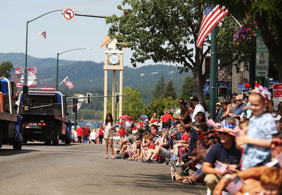 Hundreds of locals and visitors watch the Fourth of July Parade near 2nd Street in downtown Coeur d'Alene. (LOREN BENOIT/Press)