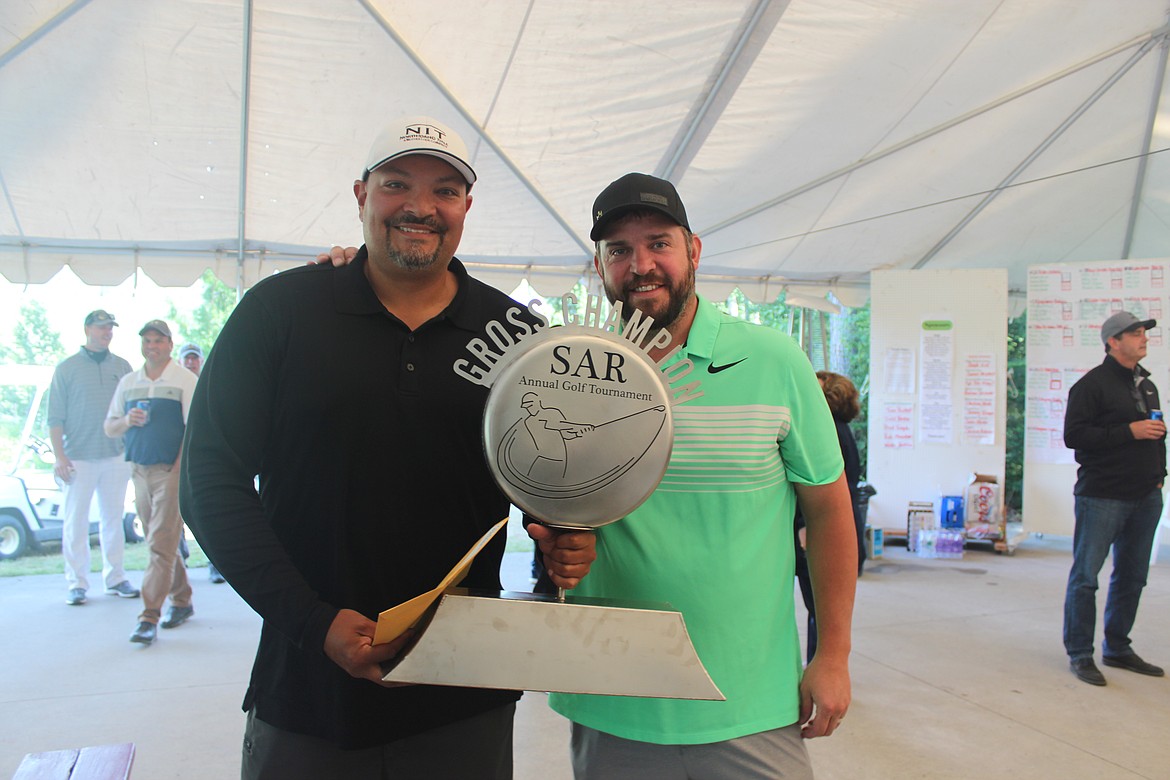 (Photo courtesy of SELKIRK ASSOCIATION OF REALTORS)
The North Idaho Title team poses with the trophy after earning the low-gross score honors at the 29th Selkirk Association of REALTORS Charity Golf Tournament at the Idaho Club on June 21.