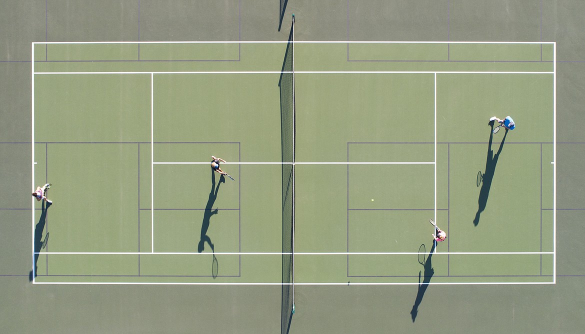 MARK ADDY/MaximumExposurePhotography.net
The long shadows of tennis players are seen Monday at Cherry Hill Park, in a photo taken with a drone.