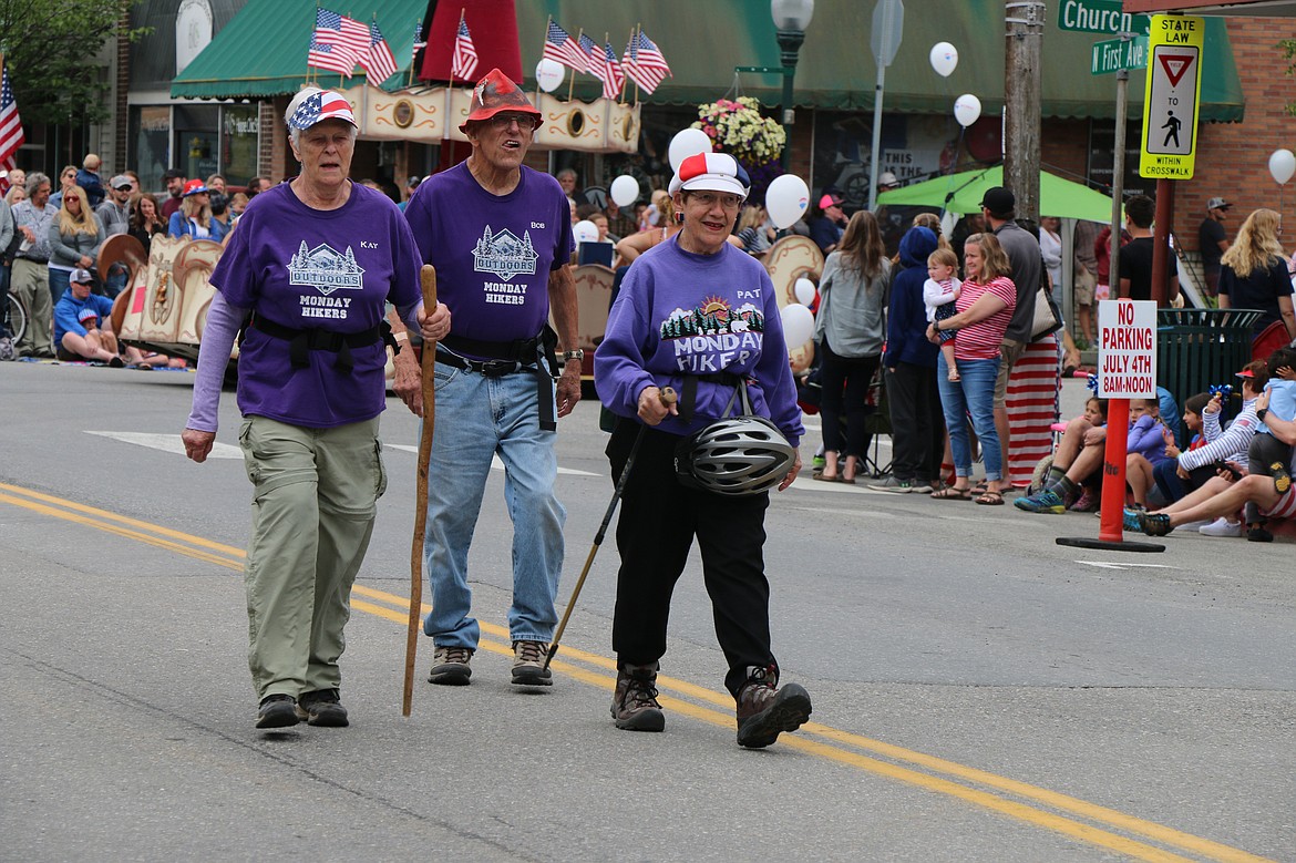 (Photo by CAROLINE LOBSINGER)Members of the Monday Hikers take part in the Sandpoint Lions' Fourth of July Grand Parade on Thursday.