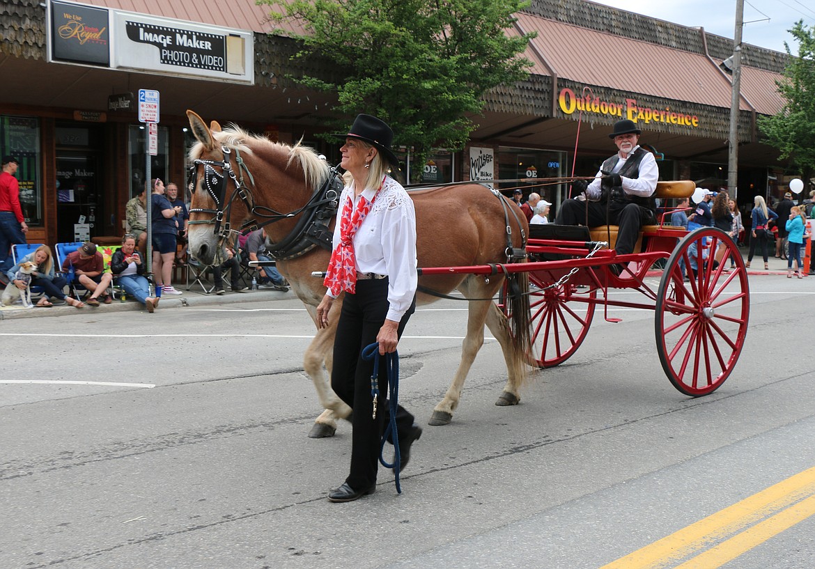 (Photo by CAROLINE LOBSINGER)Parade participants make their way down First Avenue.