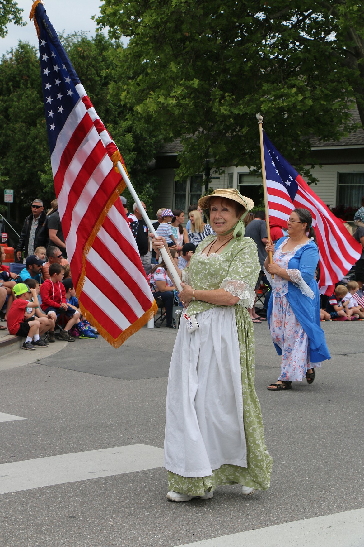 (Photo by CAROLINE LOBSINGER)Daughters of the American Revolution members make their way down Church Street during the Sandpoint Lions' Fourth of July Grand Parade on Thursday.