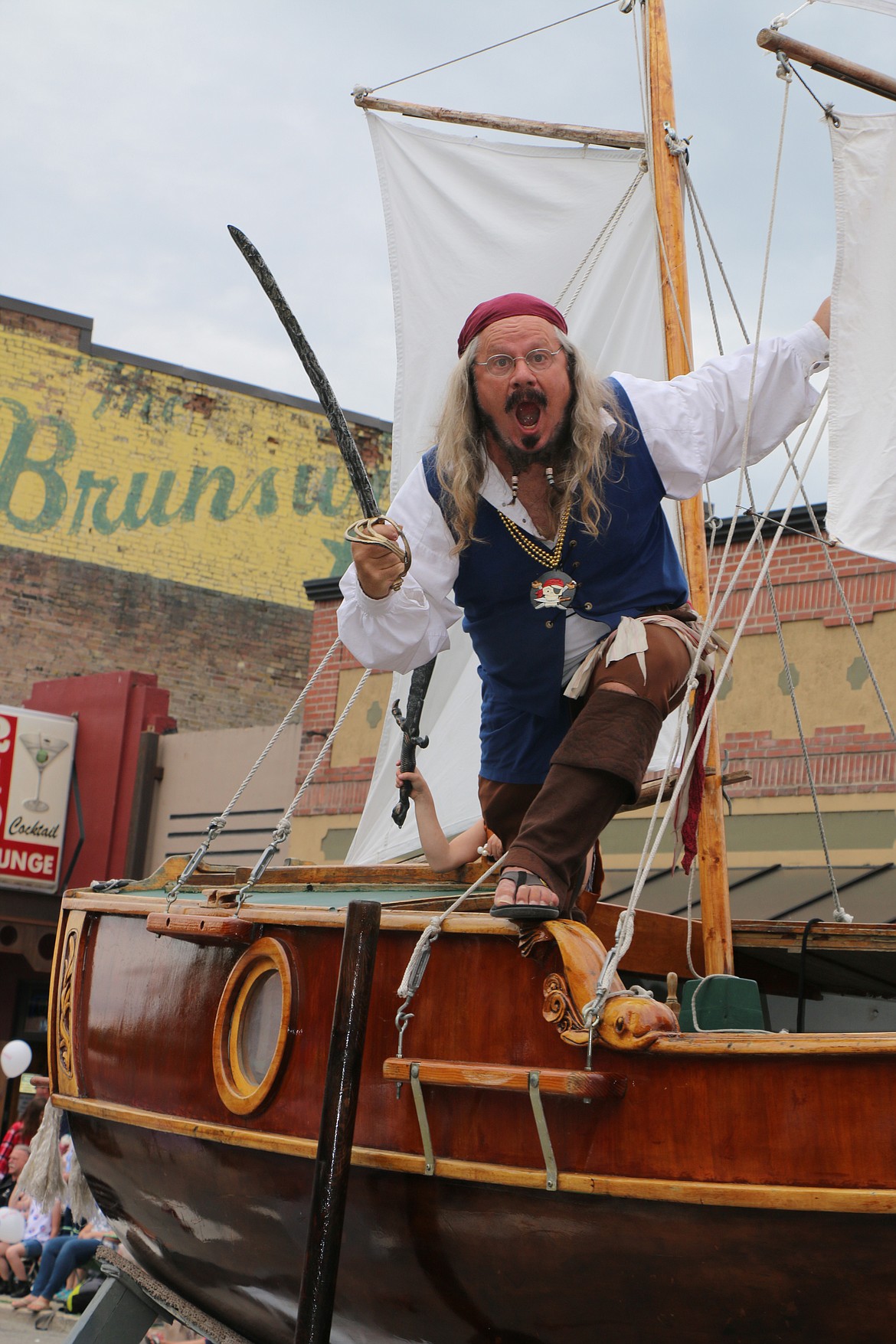 (Photo by CAROLINE LOBSINGER)Dan Mimmack glares for the camera as he rides his pirate ship down First Avenue Thursday in the Sanpoint Lions' Fourth of July Grand Parade.