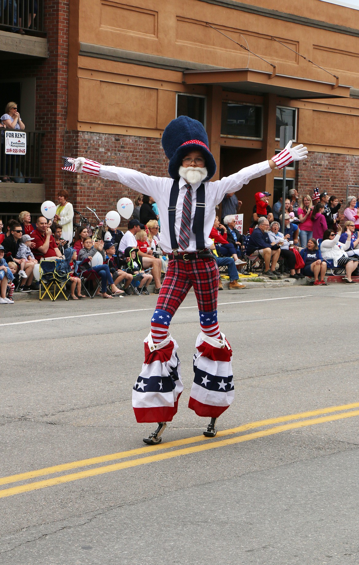 (Photo by CAROLINE LOBSINGER)A young parade participant has fun during the Sandpoint Lions' Fourth of July Grand Parade on Thursday.