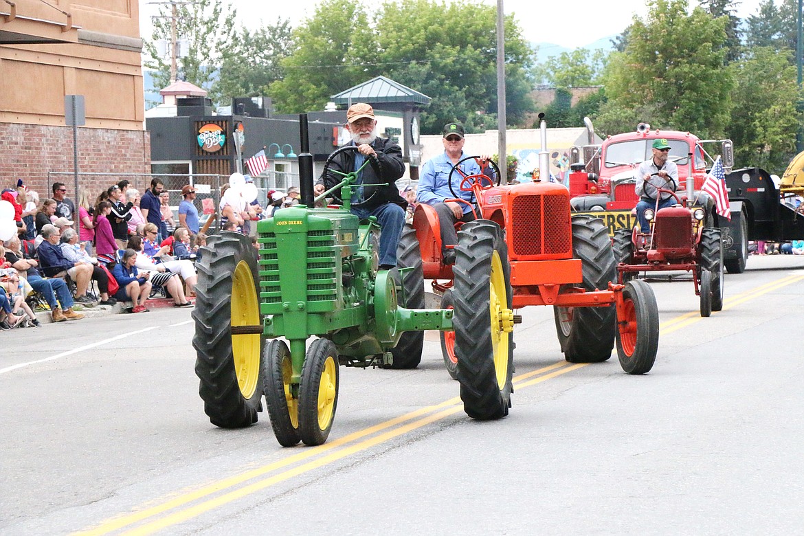 (Photo by CAROLINE LOBSINGER)Panhandle Antique Tractor &amp; Engine Club members take part in Thursday's Grand Parade.