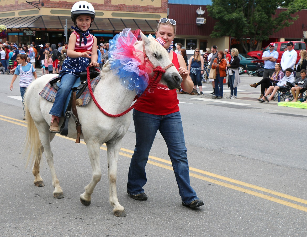 (Photo by CAROLINE LOBSINGER)A young equestrian takes part in the Grand Parade on the Fourth of July.