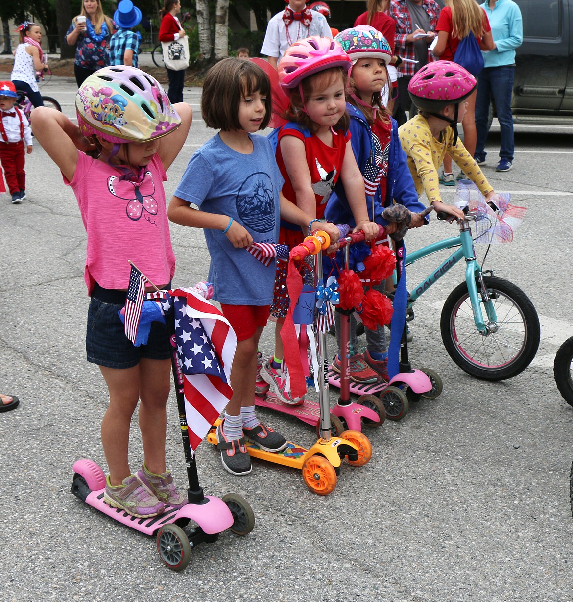 (Photo by CAROLINE LOBSINGER)Youngsters wait for the start of the Sandpoint Lions' Fourth of July Kids Parade on Thursday.