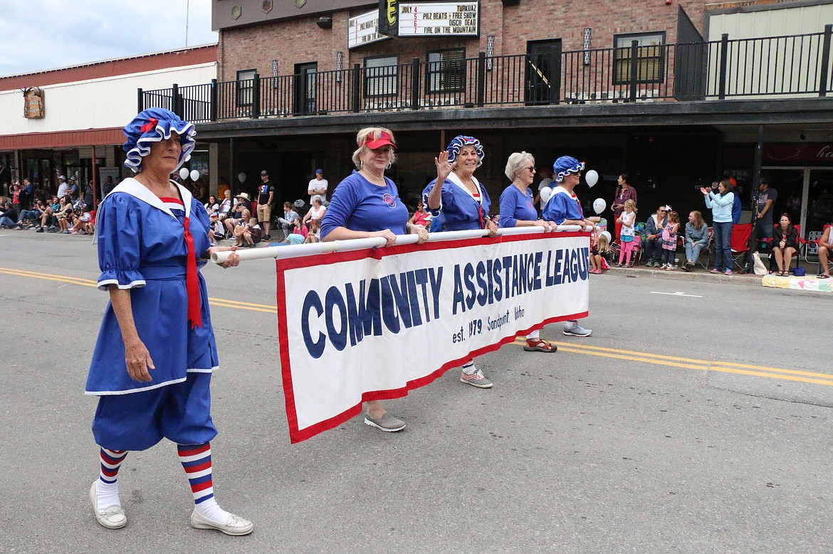 (Photo by CAROLINE LOBSINGER)Community Assistance League members make their way down First Avenue during the Sandpoint Lions' Fourth of July Grand Parade on Thursday.