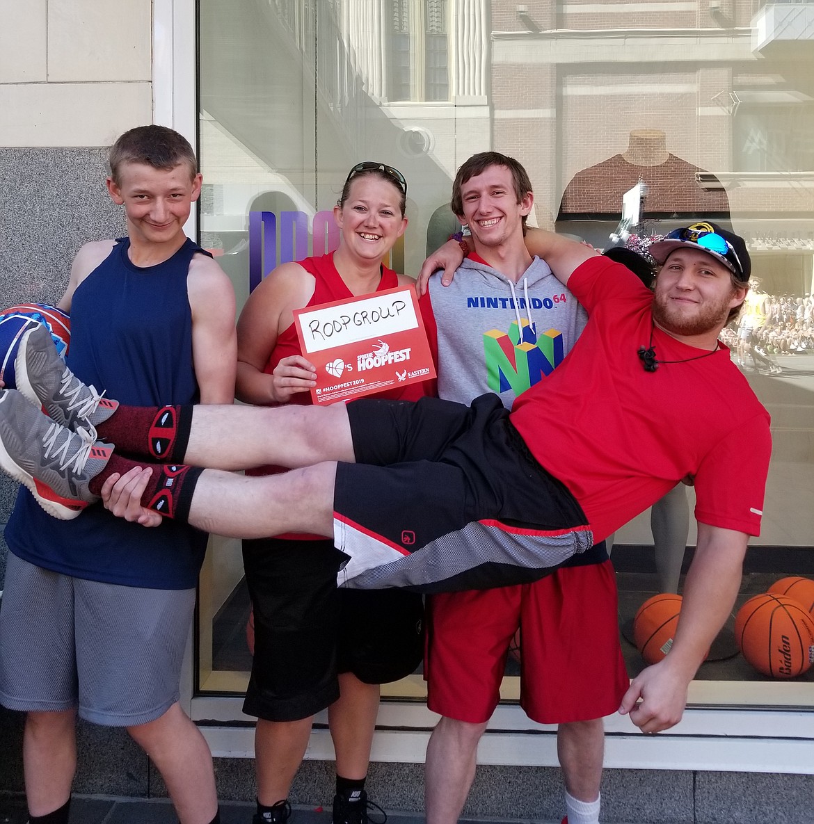 (Photo courtesy of NATASHA ROOP)
The RoopGroup team &#151; consisting of Zeke Roop, Natasha Roop, Bucky Roop and Curtis Roop &shy;&#151; poses for a team photo after finishing third in its family co-ed bracket at Hoopfest on June 29-30. The Roop family went 3-2 on the weekend and was a one-point loss away from making the championship game.