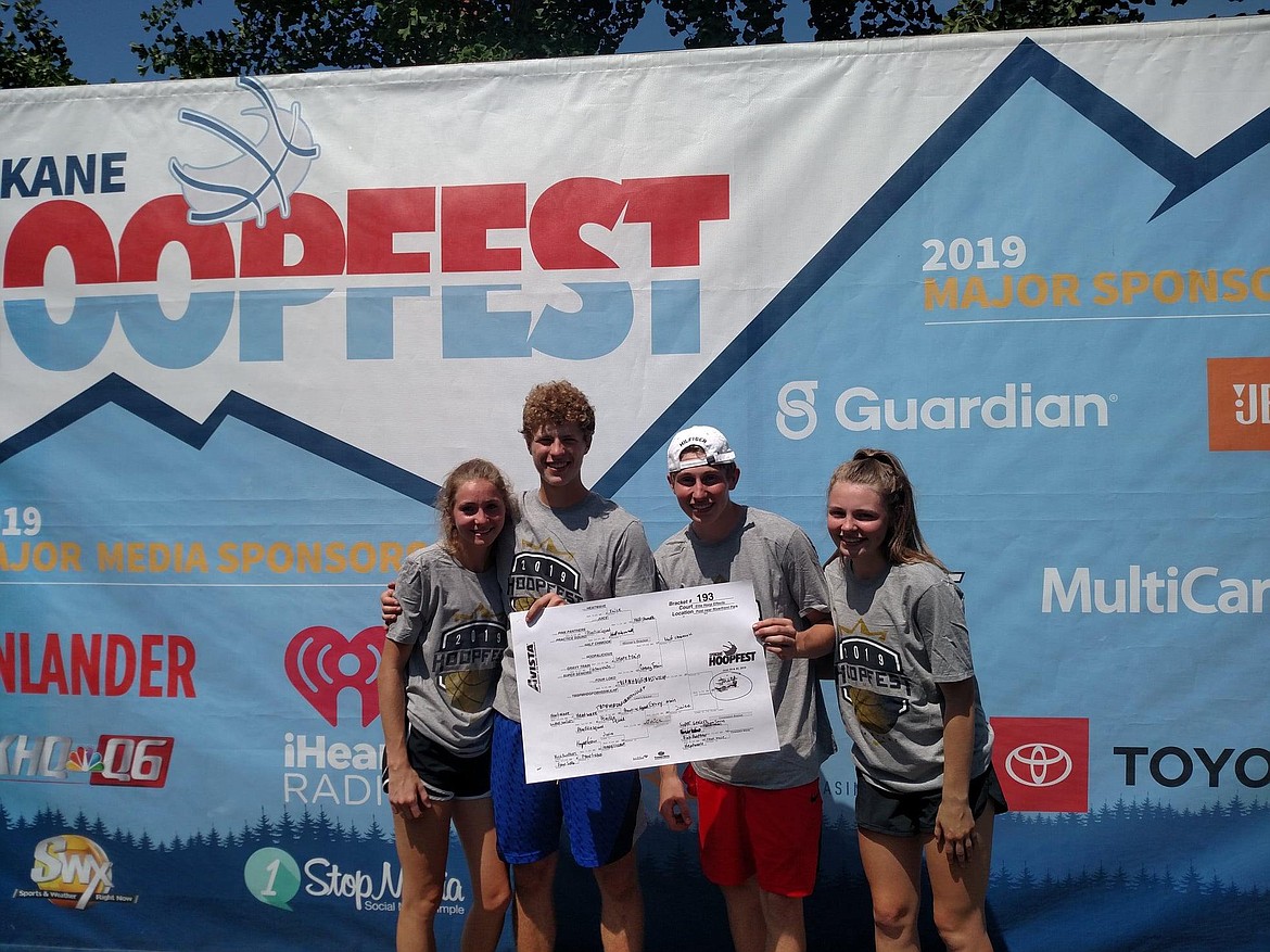 (Photo courtesy of KATIE TOMSHA)
The Juice co-ed team, consisting of Alyssa Fitzgerald, Nicholas Franks, Kobe Banks and Kaylee Banks, won their co-ed high school bracket at Hoopfest last weekend. After losing in the second round to a Half Chimook team that featured Clearwater Valley standouts Tate Pfefferkorn, Alicia Reuben and Tyler Pressley, plus Lapwai&#146;s Raylin Shippentower, the team stormed through the consolation bracket to set up a rematch with Half Chimook. The team from Sandpoint would sweep their Lewiston-area opponents in the championship, and Kobe Banks won a sportsmanship card for his conduct during the tournament.