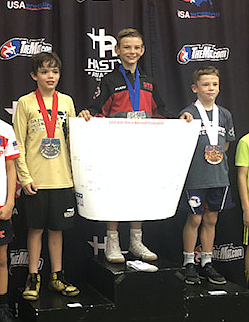 Courtesy photo
Rider Seguine of Team Real Life, who attends River City Middle School in Post Falls, won a national championship last week when he traveled with Team Idaho members to Wisconsin Dells, Wis., to compete in the USA Wrestling Kids 2019 Greco-Roman National Championships. He was joined by almost 750 of the top wrestlers from across the country. Rider came in first on June 28 in a very tough bracket to be the national champion.