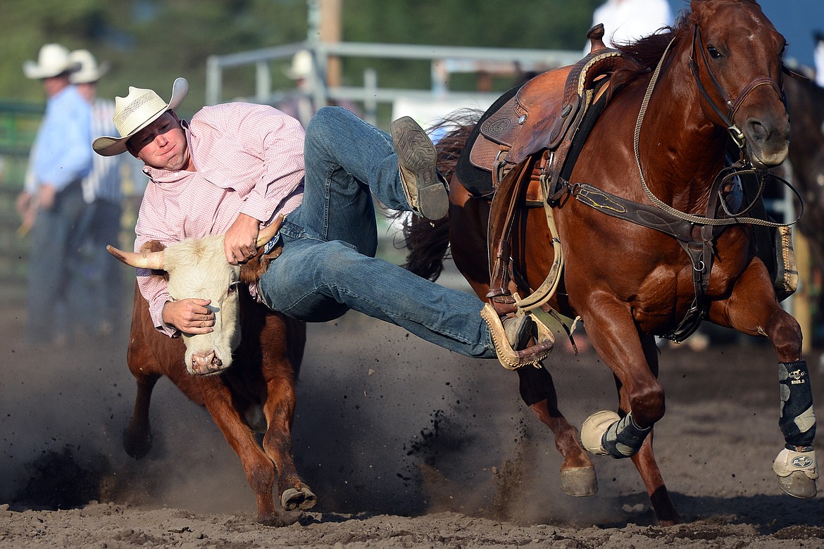 Cody Wiberg, of Victor, competes in the Steer Wrestling event at the Bigfork Rodeo on Friday. (Casey Kreider/Daily Inter Lake)