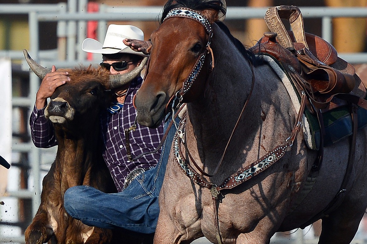 Tyler Houle, of Polson, competes in the Steer Wrestling event at the Bigfork Rodeo on Friday. (Casey Kreider/Daily Inter Lake)