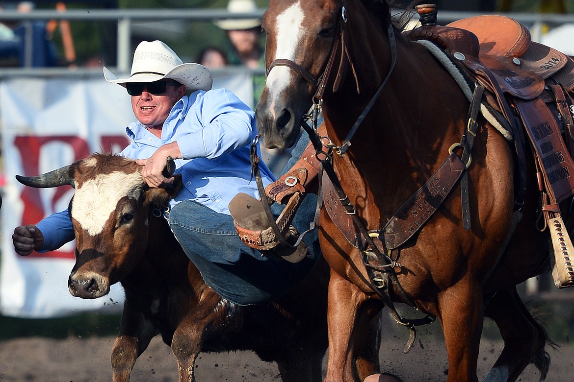 Jordan Holland, of Dillon, competes in the Steer Wrestling event at the Bigfork Rodeo on Friday. (Casey Kreider/Daily Inter Lake)