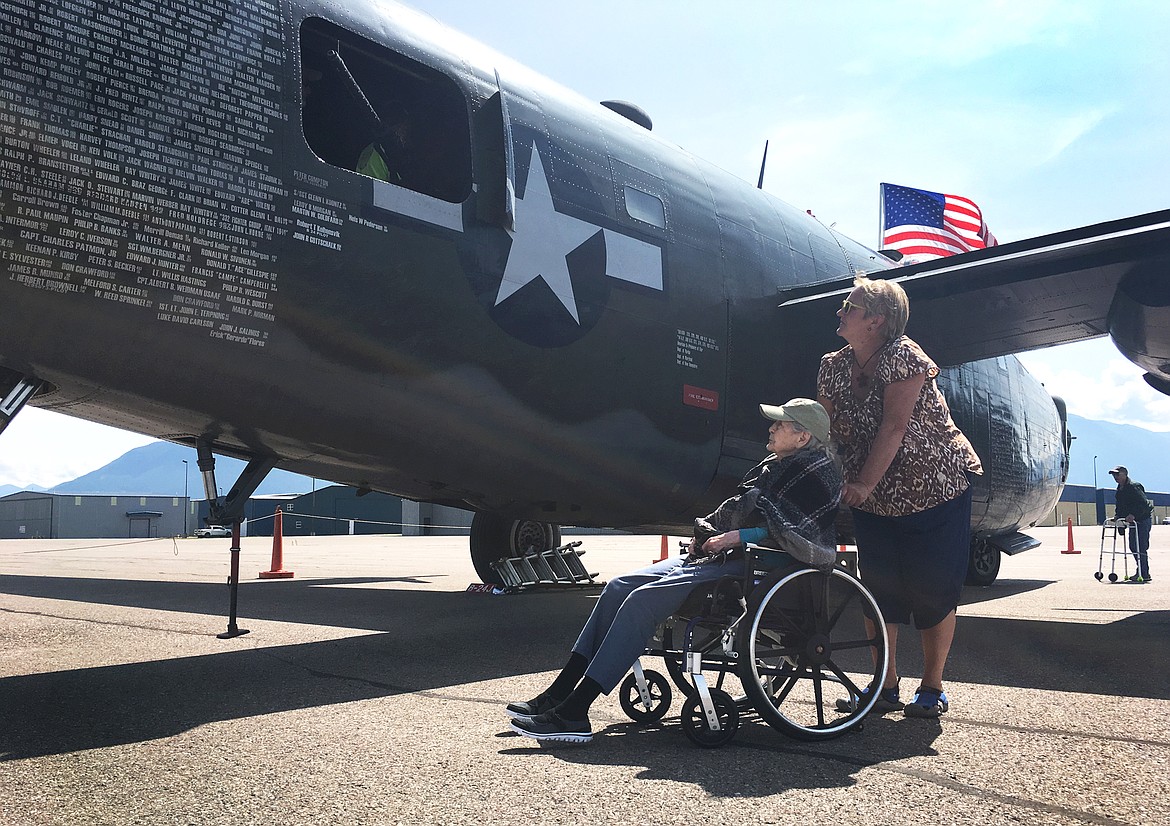 Women&#146;s Army Corps veteran Evelyn Richardson, 96, of Columbia Falls tours a B-24J Liberator with Bonnie Savage, a staff member at the Montana Veterans Home, during the Wings of Freedom Tour on Friday, July 5. (Mackenzie Reiss/Daily Inter Lake)