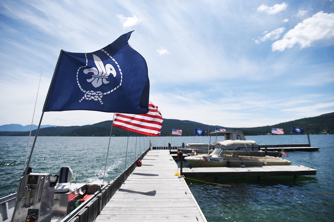 Wind whips the flags along the dock at Camp Melita Island on Flathead Lake near Big Arm on Tuesday, June 25. (Casey Kreider/Daily Inter Lake)