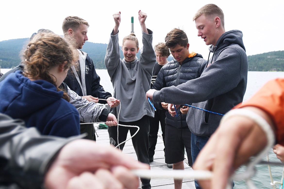A group of Boy Scouts and Venture Scouts practice tying sailing knots on a dock at Camp Melita Island on Flathead Lake near Big Arm on Tuesday, June 25. (Casey Kreider/Daily Inter Lake)
