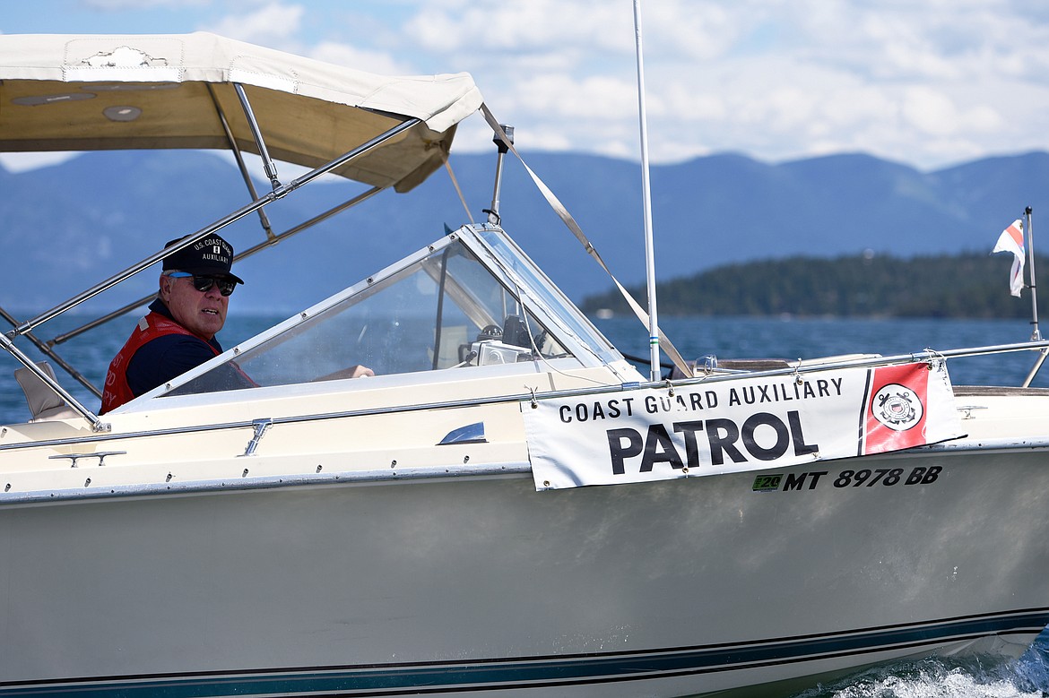 Kyle Boyce, U.S. Coast Guard Auxiliary Flotilla Commander, patrols during a demonstration near Camp Melita Island on Flathead Lake near Big Arm on Tuesday, June 25. (Casey Kreider/Daily Inter Lake)