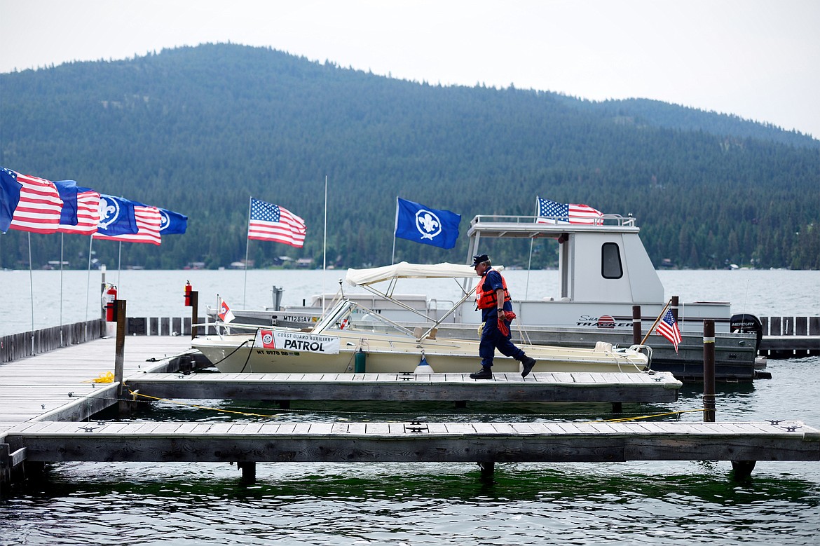 Kyle Boyce, U.S. Coast Guard Auxiliary Flotilla Commander, walks the docks on Camp Melita Island on Flathead Lake near Big Arm.