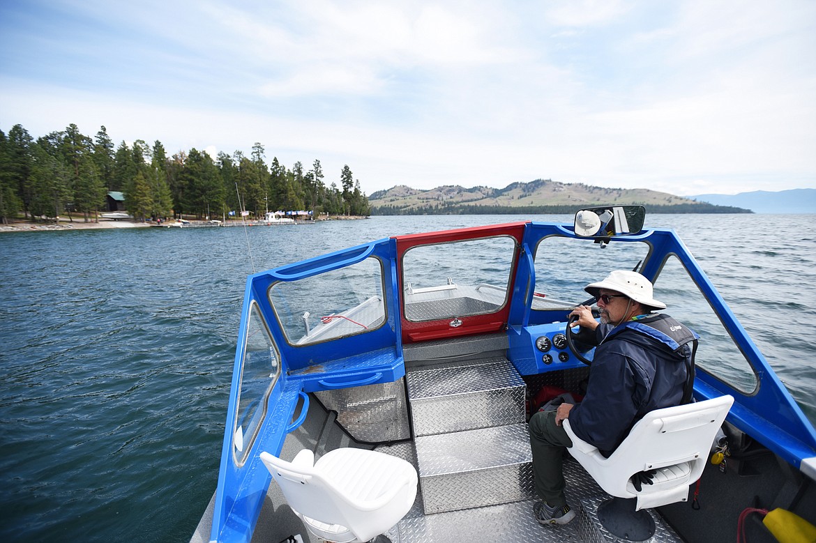 Bob Edgar, with the Bitterroot District of the Boy Scouts of America, escorts members of the media to Camp Melita Island on Flathead Lake near Big Arm on Tuesday, June 25. (Casey Kreider/Daily Inter Lake)