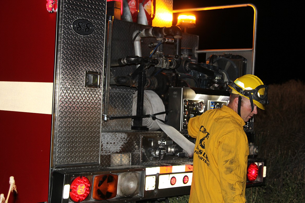 Emry Dinman/Columbia Basin Herald
 The members of the Moses Lake Fire Department&#146;s C Platoon faced a hectic night this Fourth of July, with medical calls, a string of fires and a faulty alarm that kept ringing in the Walmart deli.