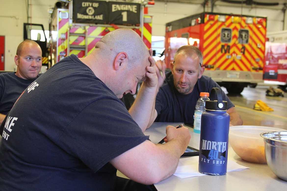 Emry Dinman/Columbia Basin Herald
 The members of the Moses Lake Fire Department&#146;s C Platoon faced a hectic night this Fourth of July, with medical calls, a string of fires and a faulty alarm that kept ringing in the Walmart deli.