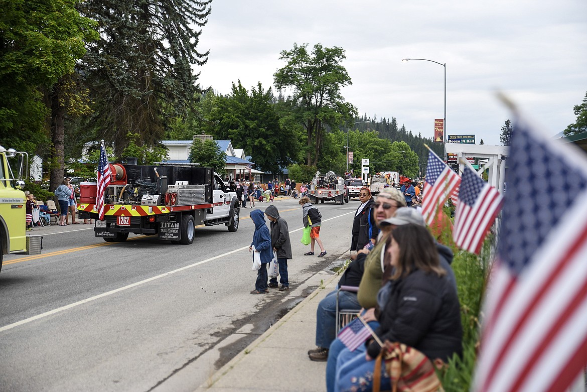 Flags and spectators line the parade route for the 4th of July Parade during Troy&#146;s Old Fashioned 4th of July Thursday. (Ben Kibbey/The Western News)