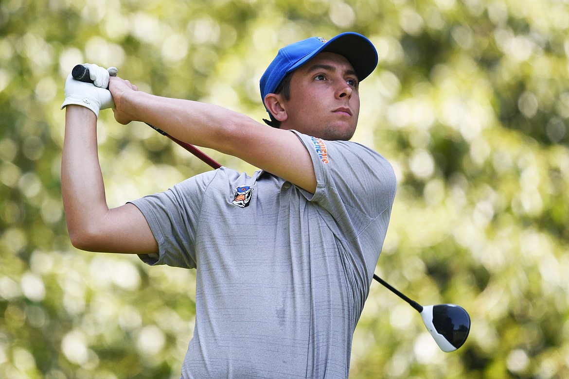 Conor Rooney watches his tee shot on the fourth hole of the South Course during the Earl Hunt Memorial 4th of July Tournament at Whitefish Lake Golf Club on Saturday. (Casey Kreider/Daily Inter Lake)