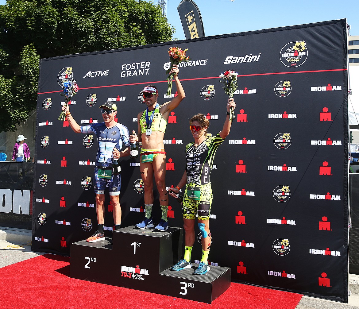 Top mens professional athletes Tim Reed, center, Sam Appleton, left, and Josh Amberger celebrate their Ironman 70.3 Coeur d&#146;Alene race finishes. (LOREN BENOIT/Press)